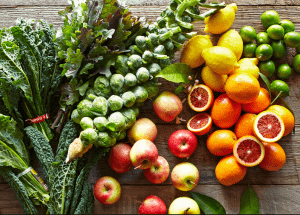a group of fruits and vegetables on a wood surface Healthy Weight Loss Diets Woburn Sands
